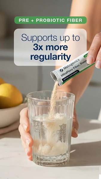 A close-up demonstration of pouring a probiotic fiber stick pack into water, highlighting the specific benefit of increased regularity.